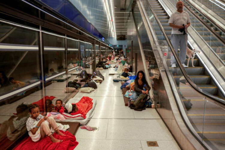 With missiles overhead, Tel Aviv residents huddle underground