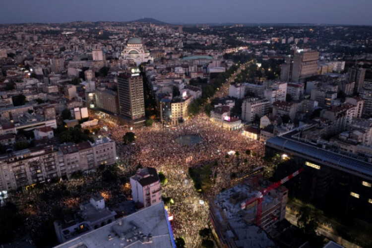 Serbian leader digs in, slams early elections rally