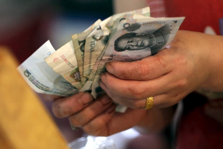 China giving rare cash handouts to the poor