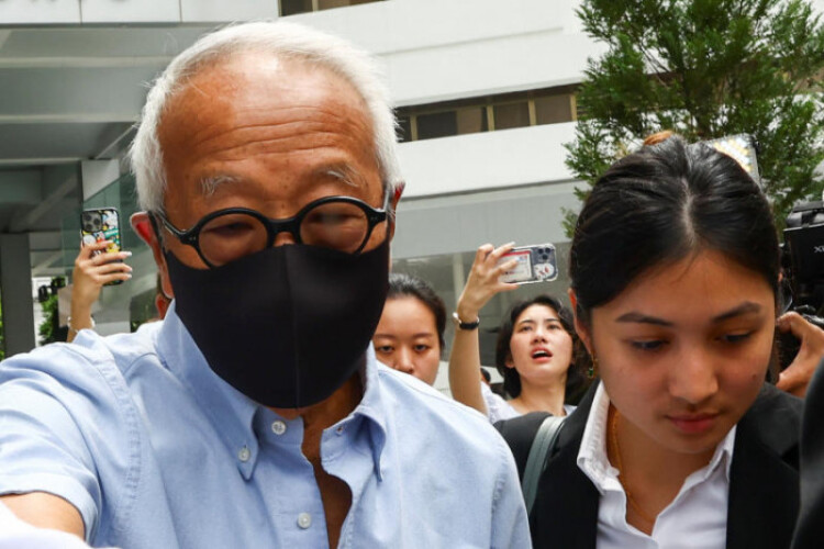 Singapore charges property billionaire linked to jailed minister's case